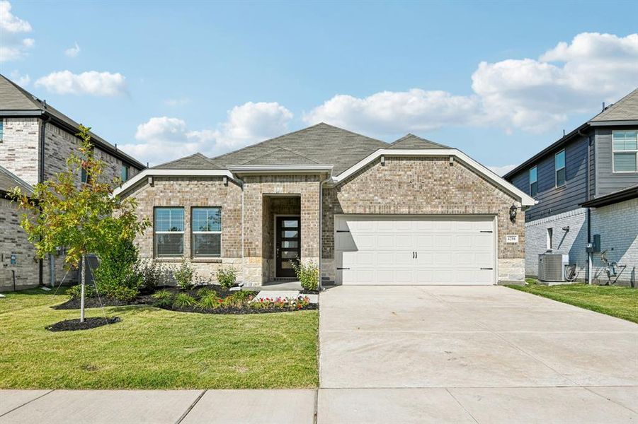 Front exterior of a new home in Lakehaven - Signature Series, Farmersville, TX, highlighting curb appeal (Image 1). Front exterior of a new home in Lakehaven - Signature Series, Farmersville, TX, highlighting curb appeal (Image 1).