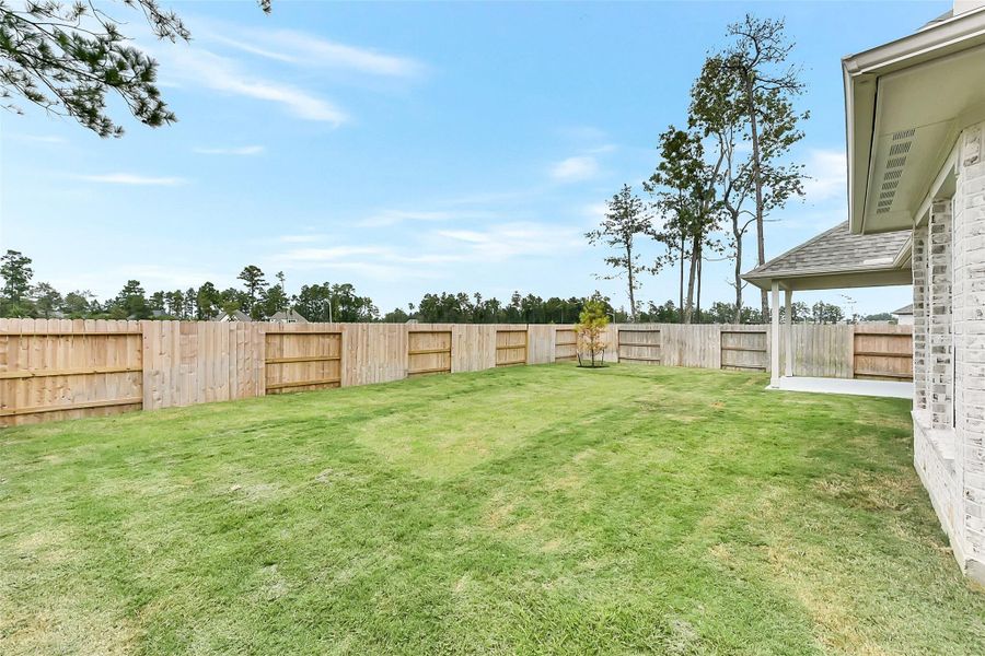 Front exterior of a new home in Evergreen 50', Conroe, TX, highlighting curb appeal (Image 19). Front exterior of a new home in Evergreen 50', Conroe, TX, highlighting curb appeal (Image 19).