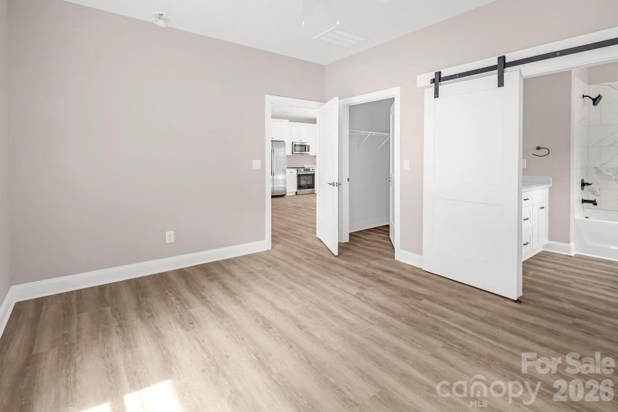 Primary Suite with walk in closet and en-suite bathroom.