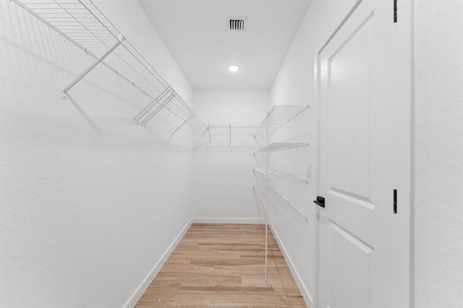 Primary Walk-in Closet Primary Walk-in Closet