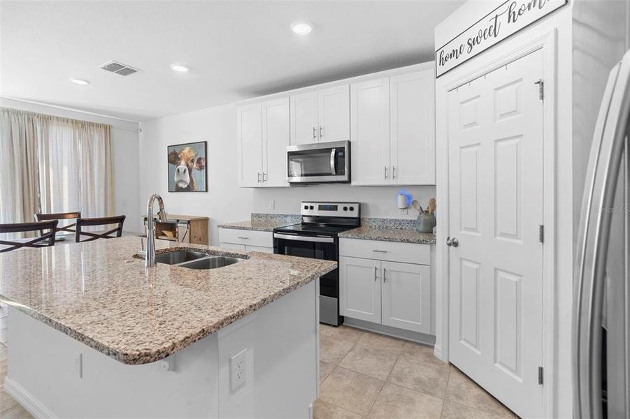 Furnished interior view inside a new home in Deer Run at Crosswinds, Davenport (Image 42).