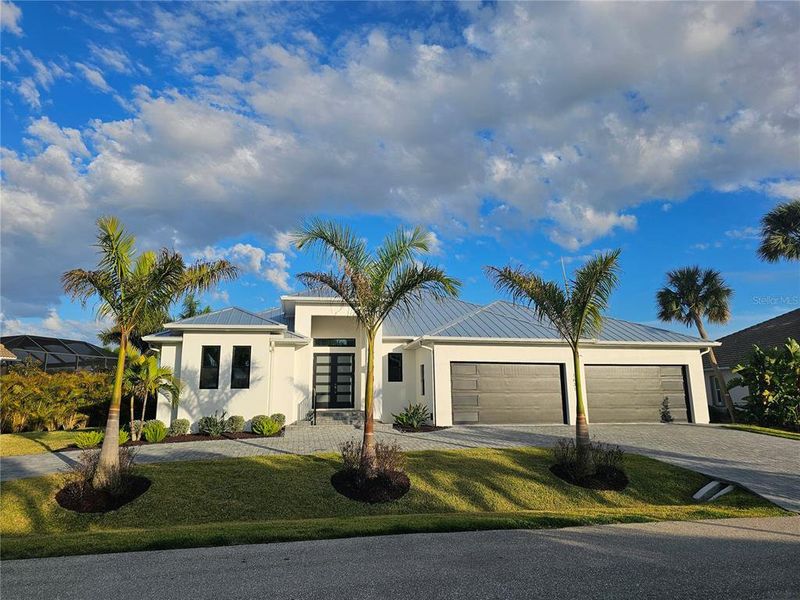 Front exterior of a new home in , Punta Gorda, FL, highlighting curb appeal (Image 2). Front exterior of a new home in , Punta Gorda, FL, highlighting curb appeal (Image 2).