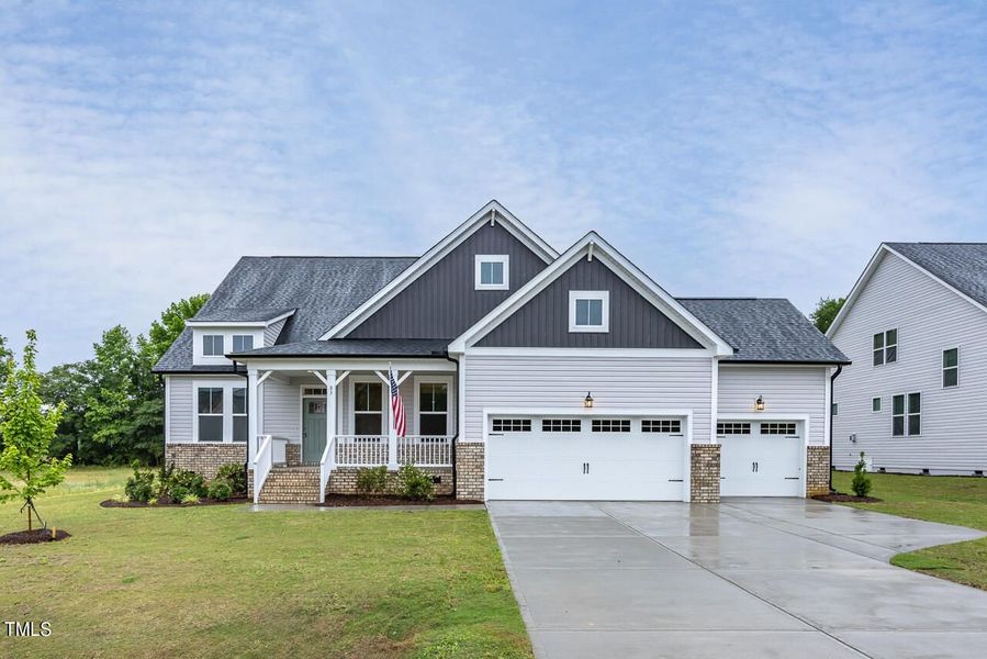 Front exterior of a new home in Tobacco Road, Angier, NC, highlighting curb appeal (Image 66).