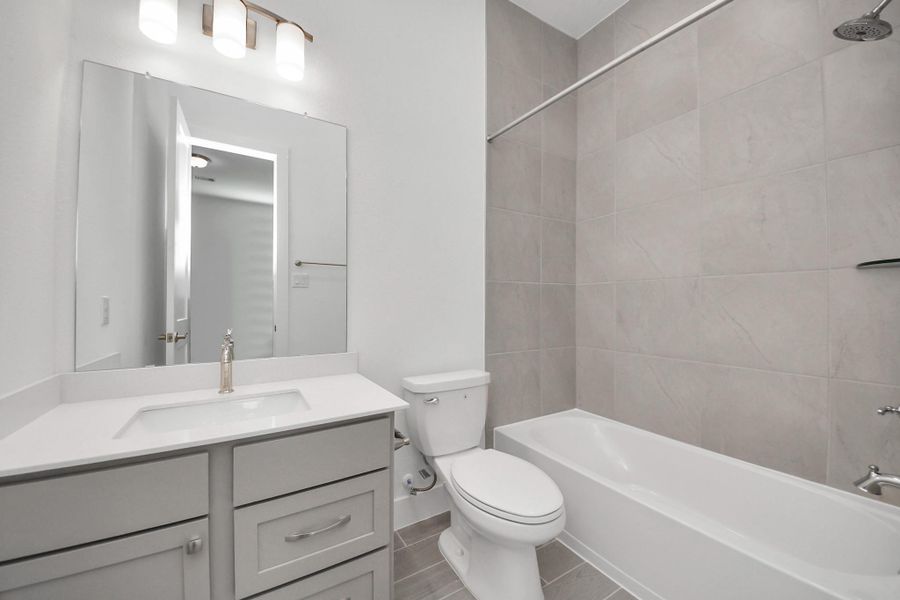 Furnished interior view inside a new home in Meridiana, Manvel (Image 12).