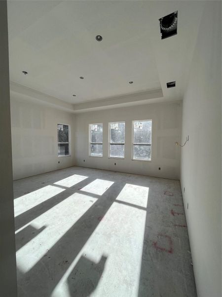 Primary bedroom with pop up ceiling.