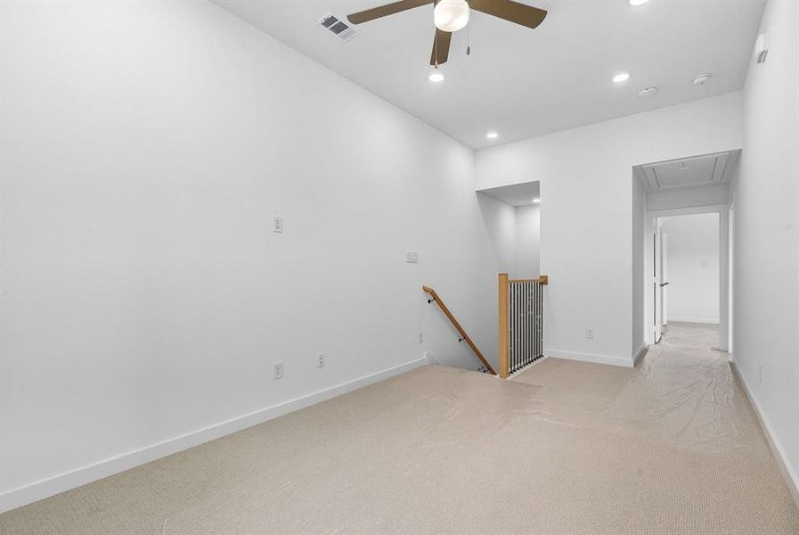 Spare room with light carpet, recessed lighting, ceiling fan, and attic access Spare room with light carpet, recessed lighting, ceiling fan, and attic access