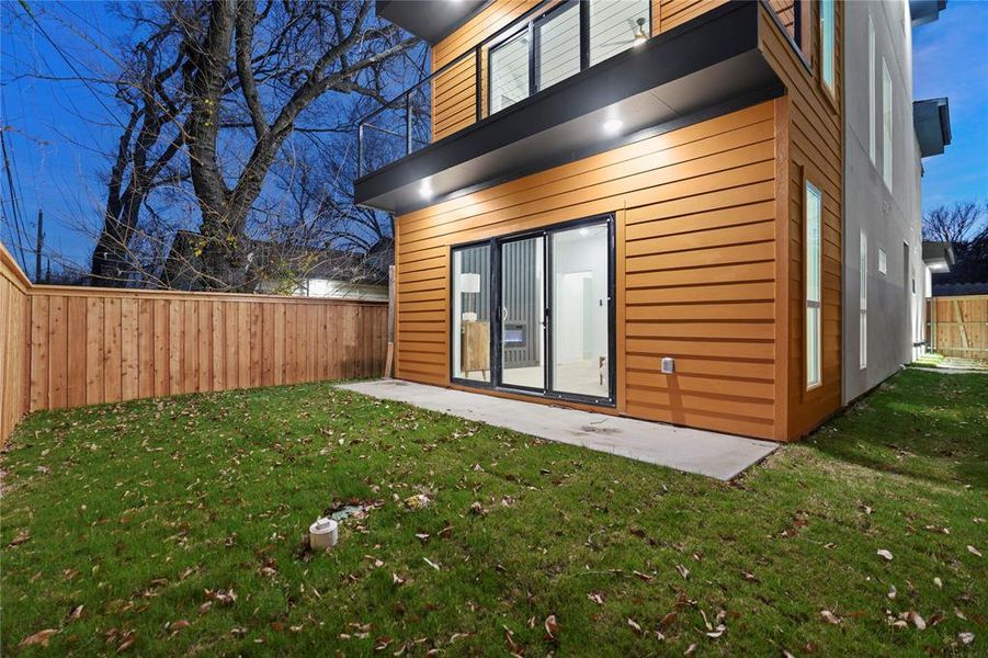 Back of property with a fenced backyard and a patio area Back of property with a fenced backyard and a patio area