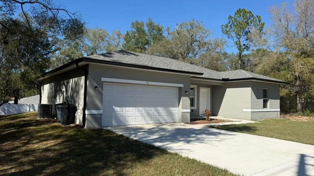 Front exterior of a new home in , Citrus Springs, FL, highlighting curb appeal (Image 1). Front exterior of a new home in , Citrus Springs, FL, highlighting curb appeal (Image 1).