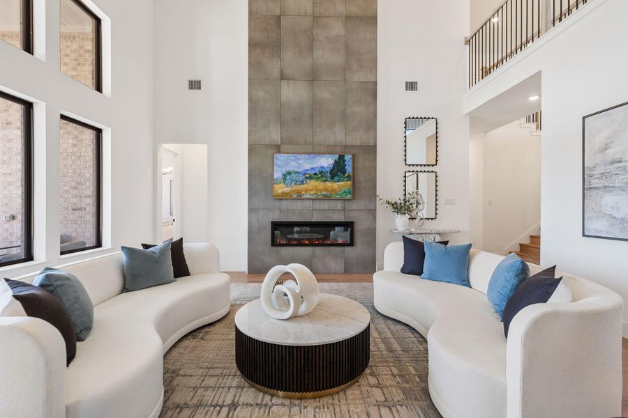 Family room is centered around a sleek fireplace Family room is centered around a sleek fireplace