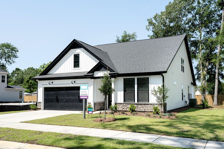 Front exterior of a new home in Indigo Place, North Charleston, SC, highlighting curb appeal (Image 26). Front exterior of a new home in Indigo Place, North Charleston, SC, highlighting curb appeal (Image 26).