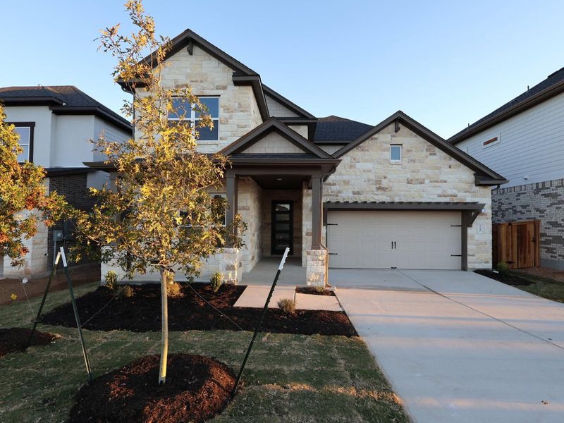 Front exterior of a new home in Edgewood, Leander, TX, highlighting curb appeal (Image 22).
