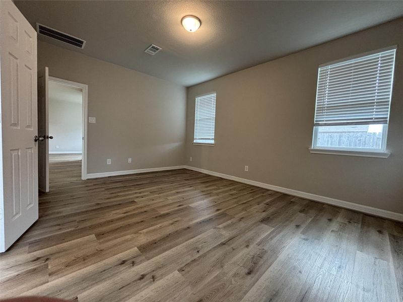 Spacious, unfurnished interior of a new home in Sunterra, Katy (Image 26).