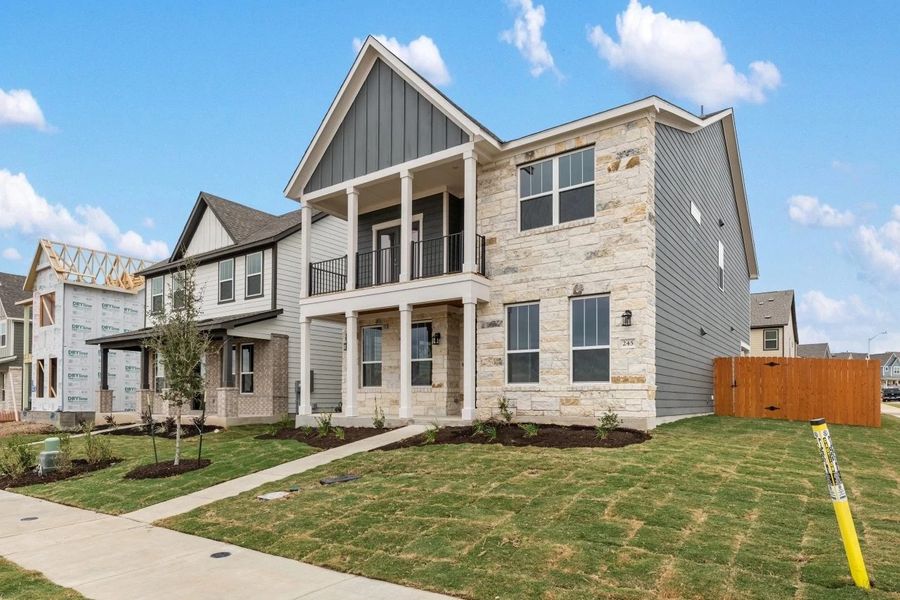 Front exterior of a new home in The Cottages at Lariat, Liberty Hill, TX, highlighting curb appeal (Image 26).