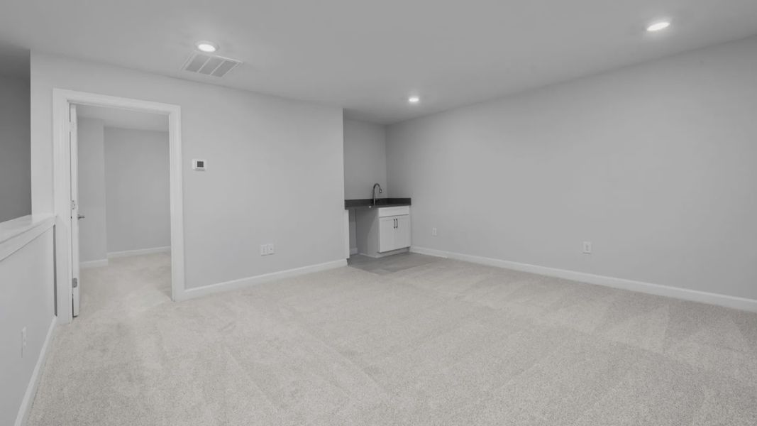 Spacious, unfurnished interior of a new home in The Courtyards at Oak Grove, Durham (Image 26).