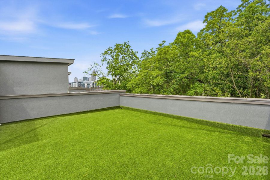 Rooftop terrace with skyline view of Uptown Charlotte