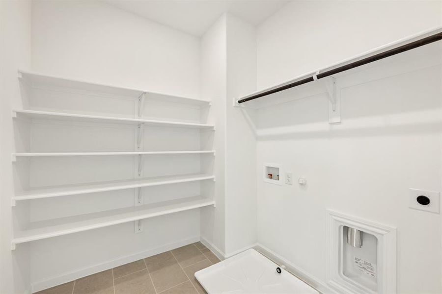 Furnished interior view inside a new home in East Oak Creek Elements, Commerce (Image 11).