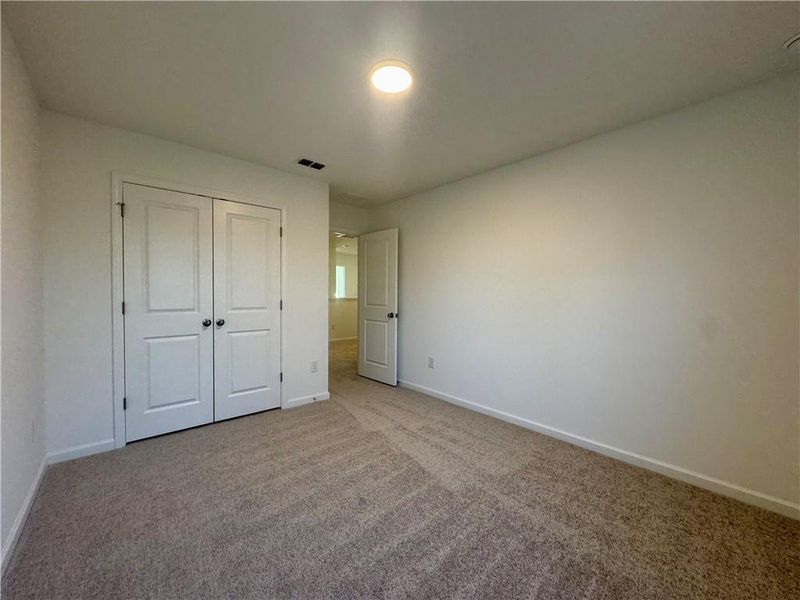 Spacious, unfurnished interior of a new home in Eastlyn Crossing, Flowery Branch (Image 26).
