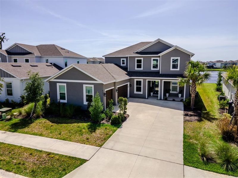 Front exterior of a new home in , Sarasota, FL, highlighting curb appeal (Image 25). Front exterior of a new home in , Sarasota, FL, highlighting curb appeal (Image 25).
