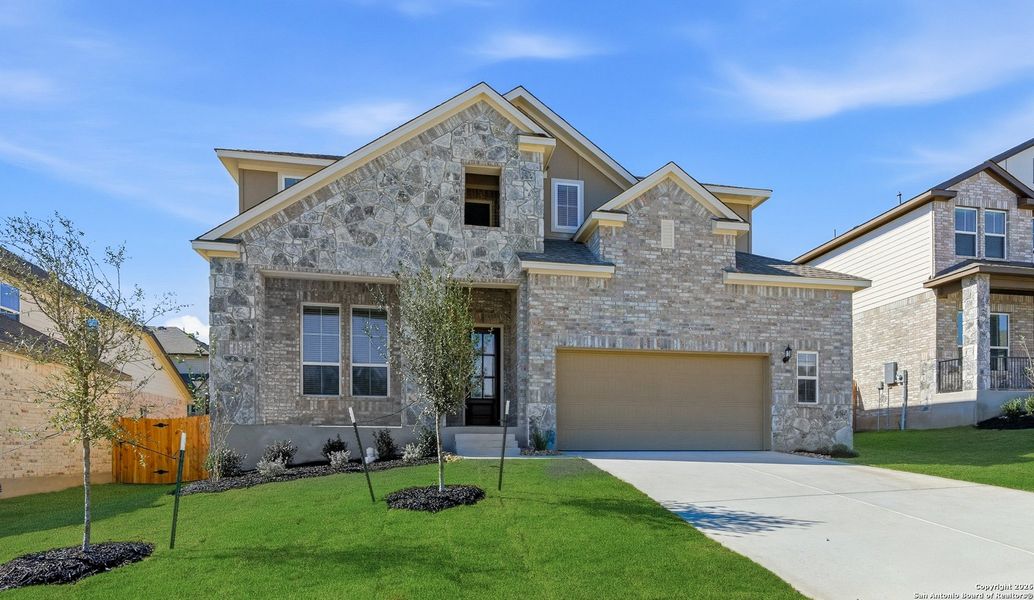 Front exterior of a new home in Buffalo Crossing, Cibolo, TX, highlighting curb appeal (Image 24).
