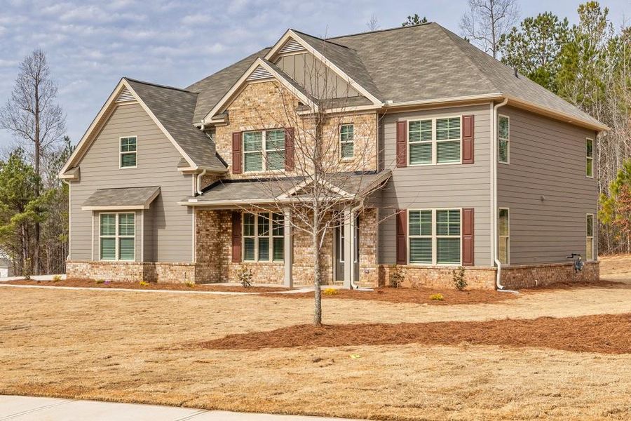 Front exterior of a new home in Ruby Creek Estates, Atlanta, GA, highlighting curb appeal (Image 2). Front exterior of a new home in Ruby Creek Estates, Atlanta, GA, highlighting curb appeal (Image 2).