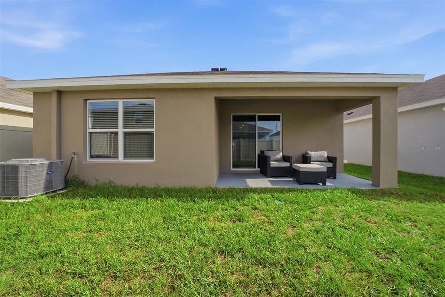 Exterior details and patio area of a home in Harvest Ridge, Zephyrhills (Image 22).