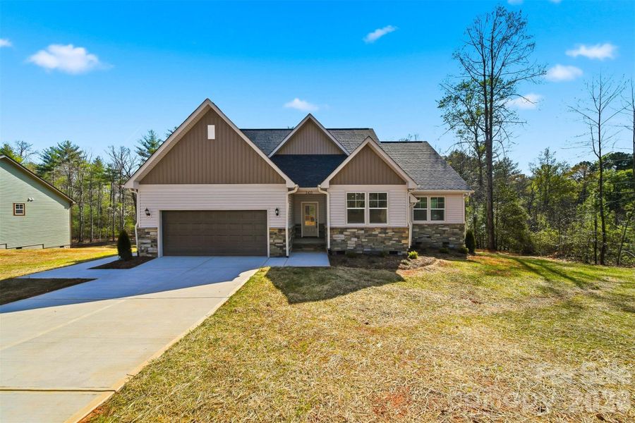Front exterior of a new home in , Morganton, NC, highlighting curb appeal (Image 24).