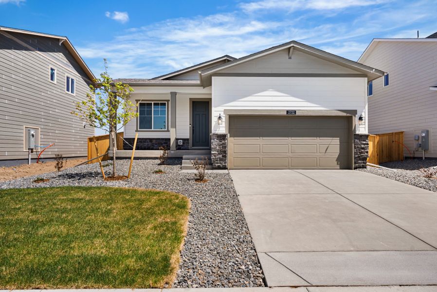 Front exterior of a new home in Wolf Creek Run West, Strasburg, CO, highlighting curb appeal (Image 13).