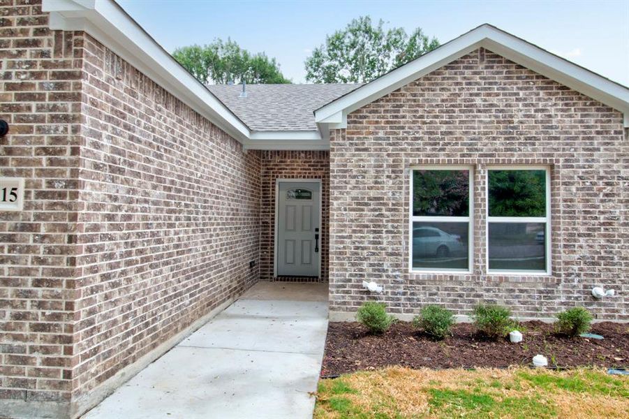View of exterior entry featuring brick siding View of exterior entry featuring brick siding