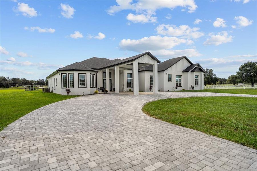 Front exterior of a new home in , Groveland, FL, highlighting curb appeal (Image 20).