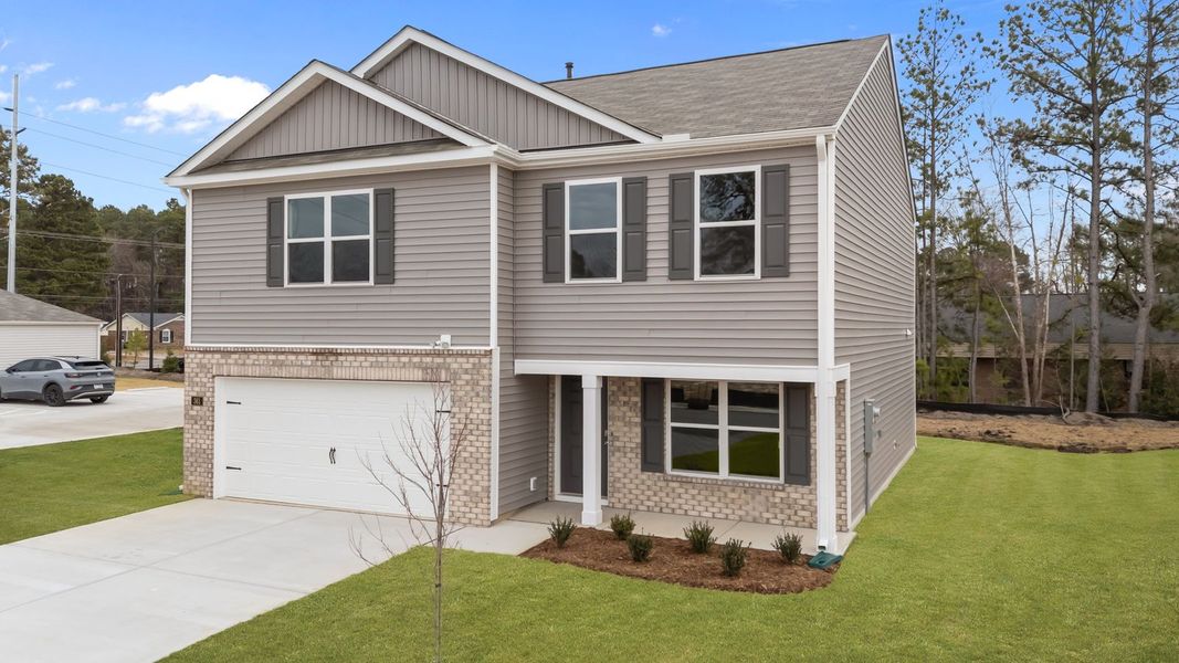 Front exterior of a new home in Hunter Hill, Rocky Mount, NC, highlighting curb appeal (Image 21). Front exterior of a new home in Hunter Hill, Rocky Mount, NC, highlighting curb appeal (Image 21).