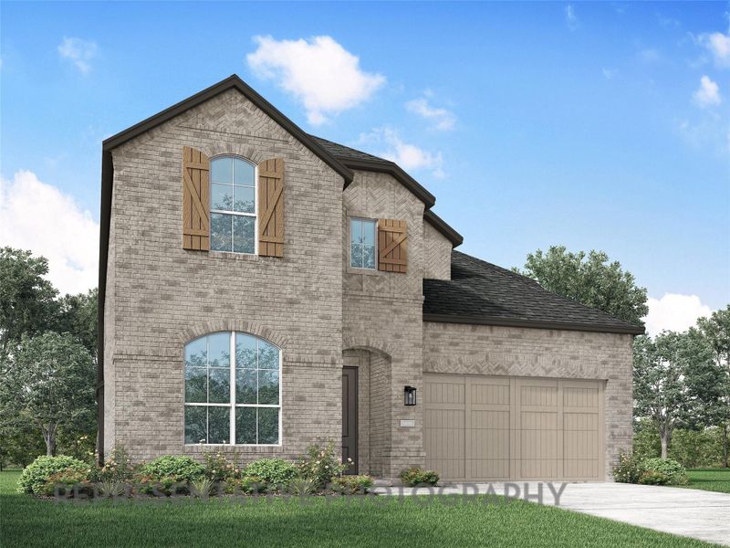 French provincial home featuring brick siding, an attached garage, concrete driveway, and a front yard