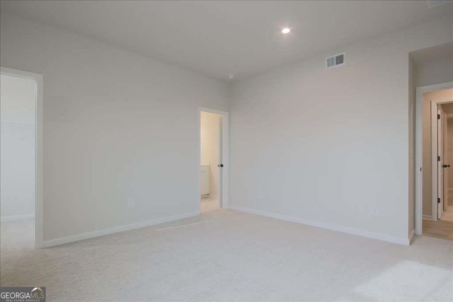 Spacious, unfurnished interior of a new home in The Paddocks at Doc Hughes, Buford (Image 41).