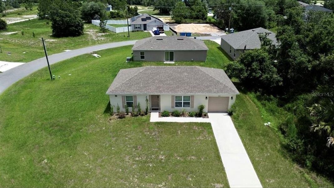 Front exterior of a new home in Poinciana, Poinciana, FL, highlighting curb appeal (Image 2). Front exterior of a new home in Poinciana, Poinciana, FL, highlighting curb appeal (Image 2).
