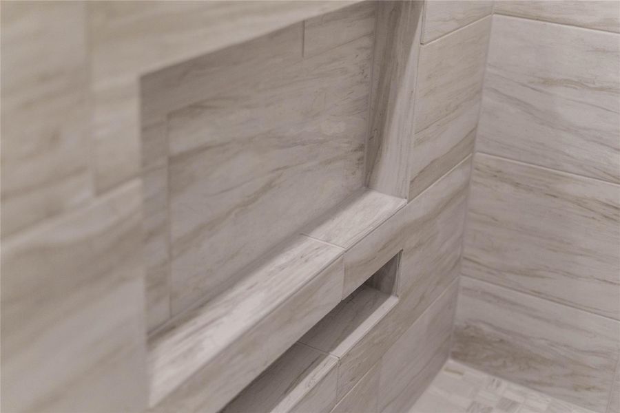 Built-in storage: Features a generous, seamlessly integrated tiled shampoo niche and accent ledge for easy organization. Built-in storage: Features a generous, seamlessly integrated tiled shampoo niche and accent ledge for easy organization.