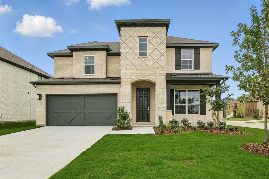 View of front of home with driveway, a shingled roof, a front yard, an attached garage, and stone siding View of front of home with driveway, a shingled roof, a front yard, an attached garage, and stone siding