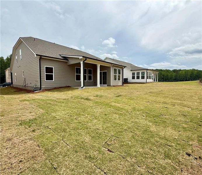 Exterior details and patio area of a home in Ponderosa Farms Reserve, Gainesville (Image 29).