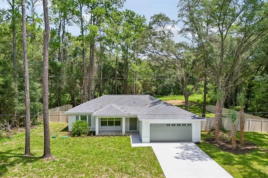 Front exterior of a new home in , Citrus Springs, FL, highlighting curb appeal (Image 27). Front exterior of a new home in , Citrus Springs, FL, highlighting curb appeal (Image 27).