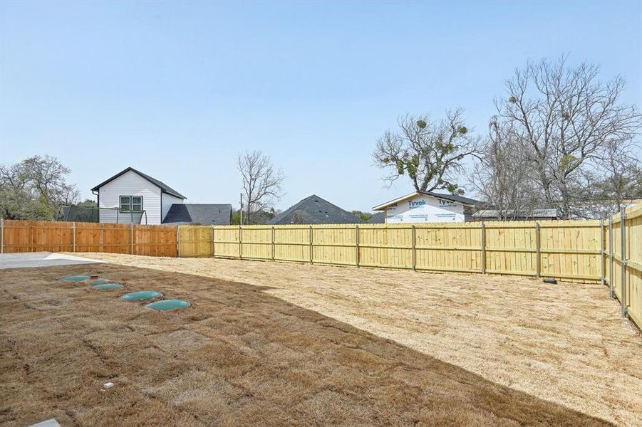 View of yard featuring a fenced backyard