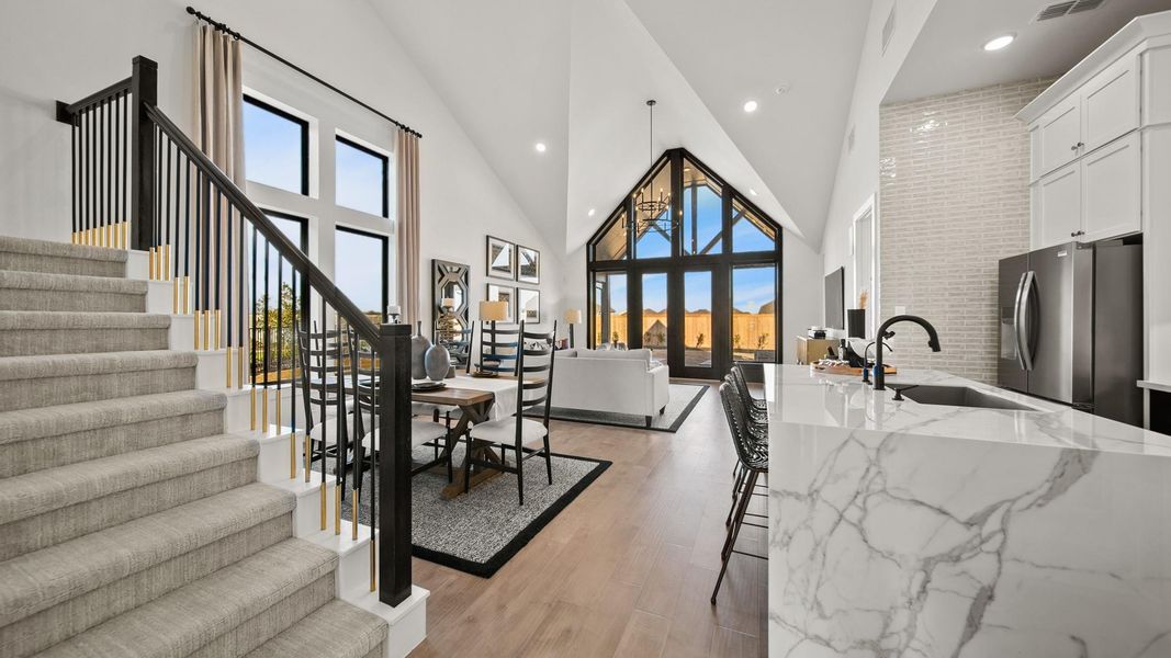 Striking vaulted ceilings in the family room with a 3D-style window wall from the ceiling to the floor that grabs your attention and won't let go! Striking vaulted ceilings in the family room with a 3D-style window wall from the ceiling to the floor that grabs your attention and won't let go!