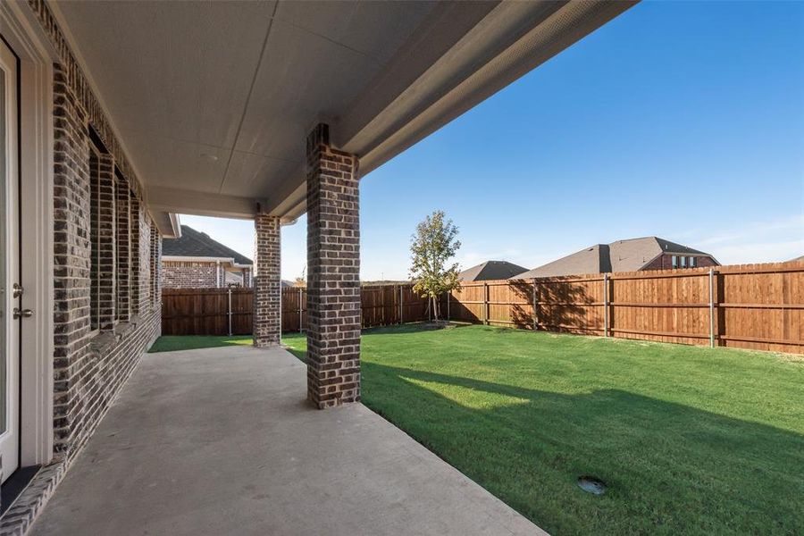 Exterior details and patio area of a home in Villages of Hurricane Creek, Anna (Image 4).