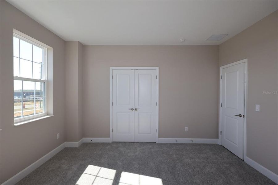 Spacious, unfurnished interior of a new home in Lake Star at Ovation, Winter Garden (Image 12).