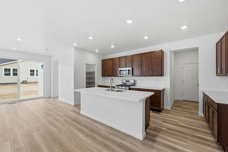 Furnished interior view inside a new home in The Aurora Highlands, Aurora (Image 6).