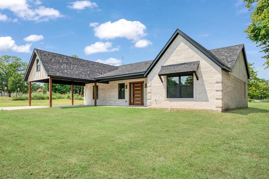 Front exterior of a new home in , Roxton, TX, highlighting curb appeal (Image 2).