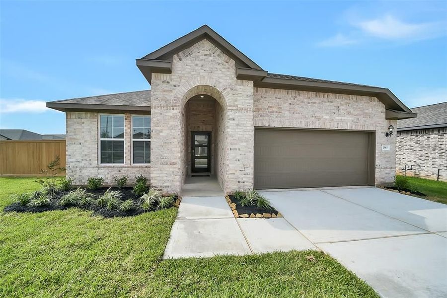 Front exterior of a new home in Sunterra, Katy, TX, highlighting curb appeal (Image 27).