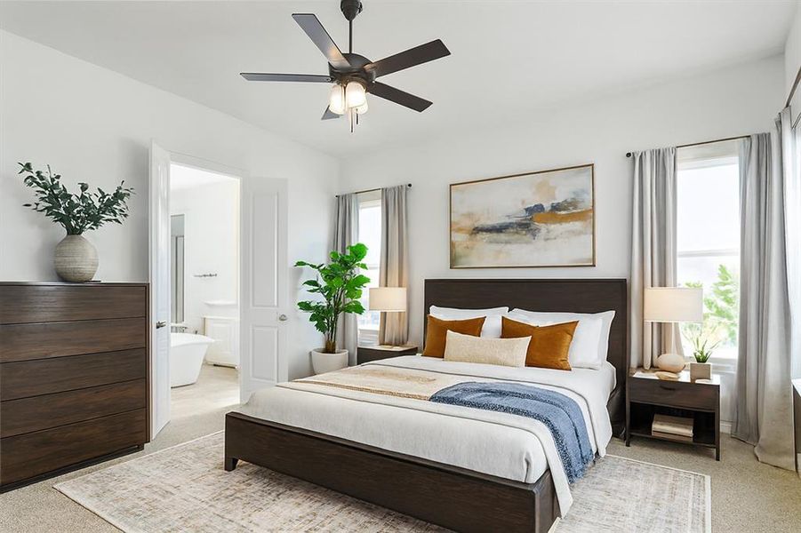 Carpeted bedroom featuring ensuite bathroom and a ceiling fan