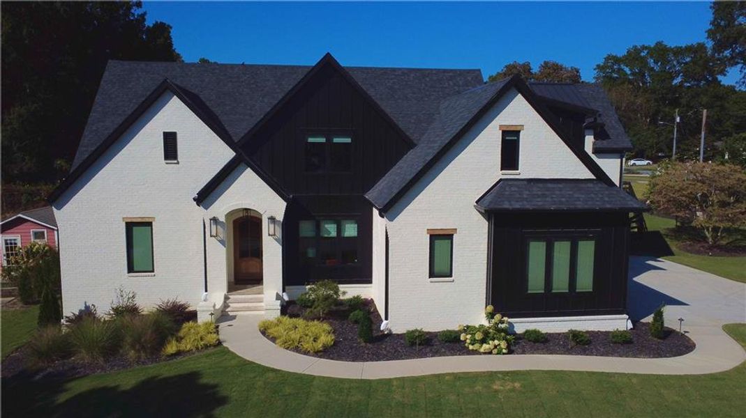 Front exterior of a new home in , Alpharetta, GA, highlighting curb appeal (Image 1).