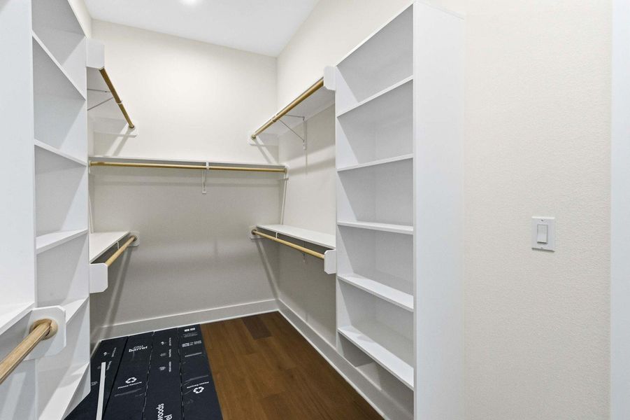 Ample shelving and hanging space defines this spacious walk-in wardrobe. Ample shelving and hanging space defines this spacious walk-in wardrobe.