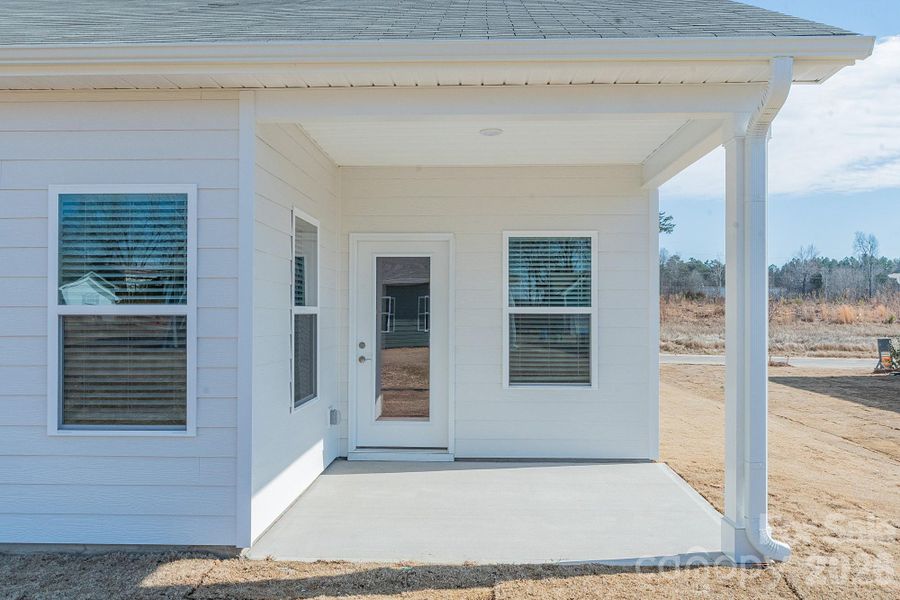 Exterior details and patio area of a home in Pine Bluff, Midland (Image 3). Exterior details and patio area of a home in Pine Bluff, Midland (Image 3).