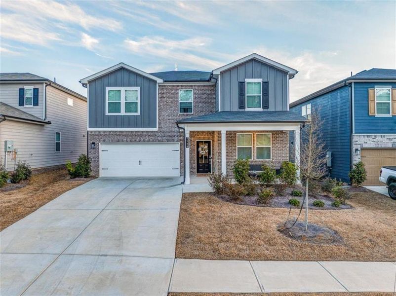 Front exterior of a new home in Kingsley Creek, Lithonia, GA, highlighting curb appeal (Image 1). Front exterior of a new home in Kingsley Creek, Lithonia, GA, highlighting curb appeal (Image 1).