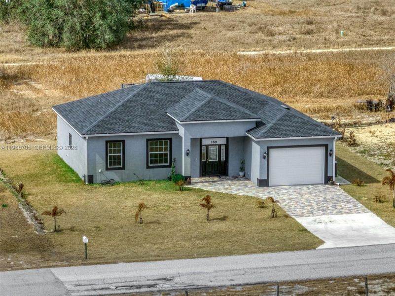 Front exterior of a new home in , Avon Park, FL, highlighting curb appeal (Image 26).